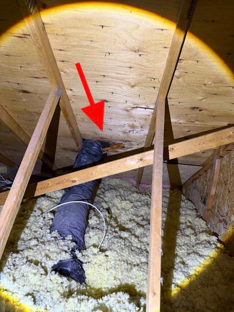 Possible moisture staining on attic roof sheathing during home inspection